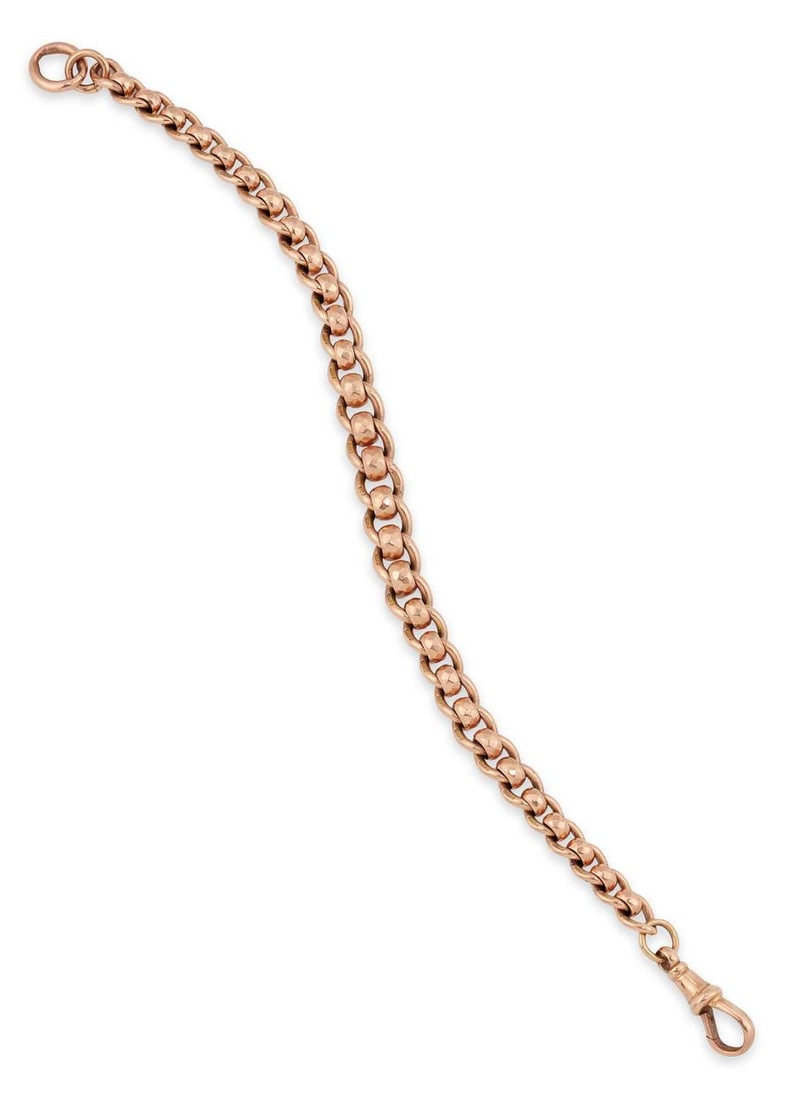 A 9 CARAT GOLD FANCY CURB LINK BRACELET: graduated curb links tied by faceted links, converted from an Albert chain, stamped '9.375'. 20cm long, 20.6 grams Good condition