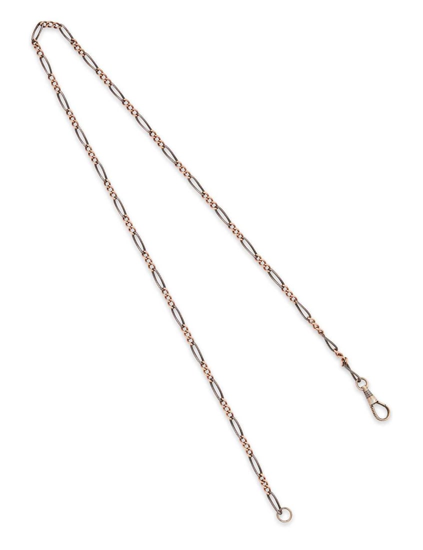 A FANCY NIELLO CHAIN: long niello links alternating with sections of curb link chain, with niello dog clip, unmarked. 60cm long, 17 grams Good condition