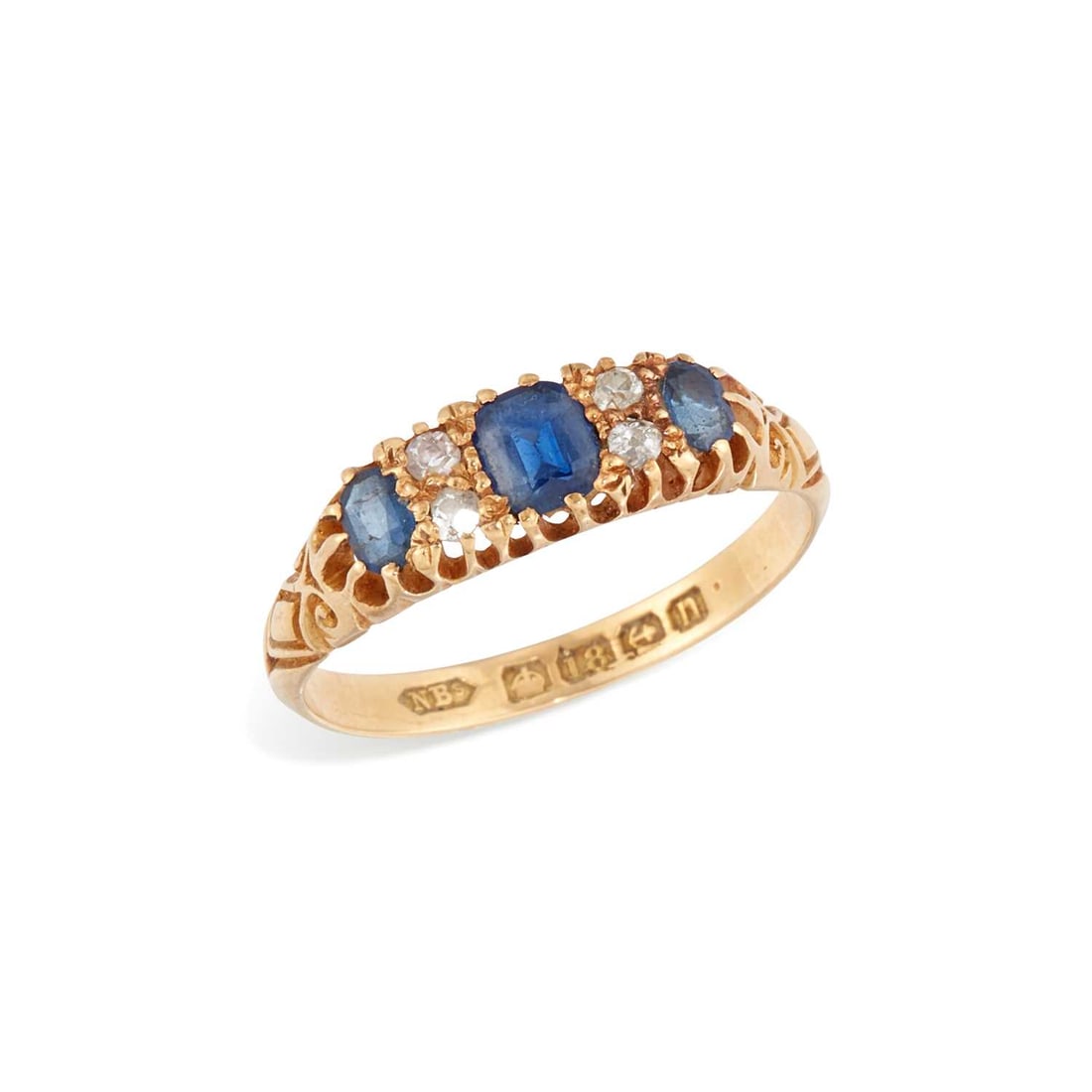 AN 18 CARAT GOLD SAPPHIRE AND DIAMOND BOAT RING: three cushion-cut sapphires spaced by pairs of round-cut diamonds, to carved shoulders, hallmarked Birmingham, 1912. Ring size P, 2.8 grams Light abrasion to the sapphires, one diamond a later eight-c