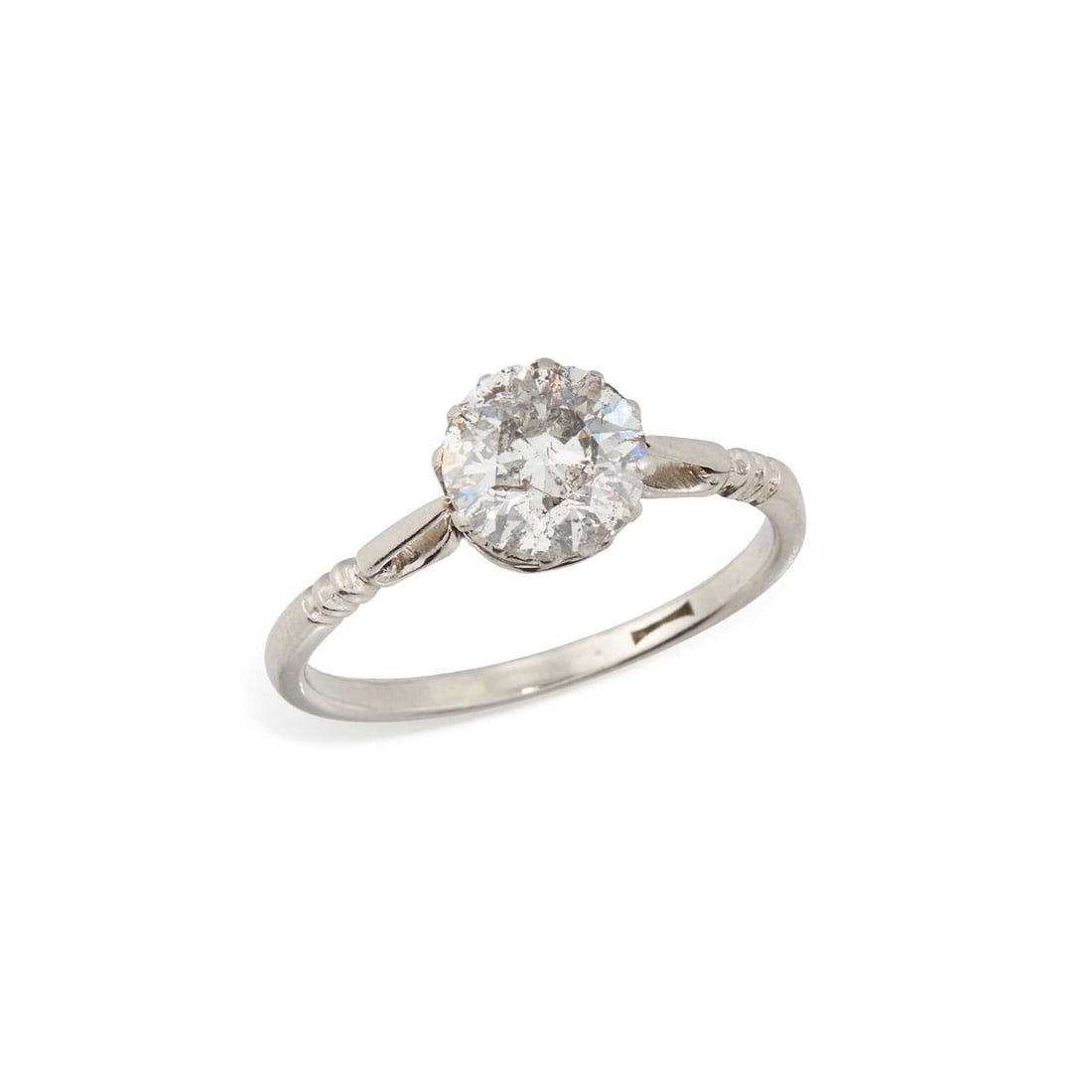 A SOLITAIRE DIAMOND RING: a round-cut diamond to notched shoulders, unmarked. Estimated diamond weight 1.35 carat, ring size P, 3.4 grams Some chips to the girdle, claws require retipping. Estimated diamond colour: H/I, estima
