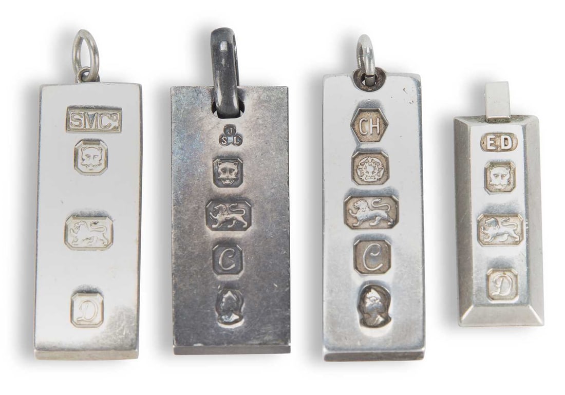 FOUR SILVER INGOT PENDANTS: comprising two silver 1977 Jubilee pendants and two hallmarked London 1978. (4) 4cm long and smaller, 101 grams gross Good condition