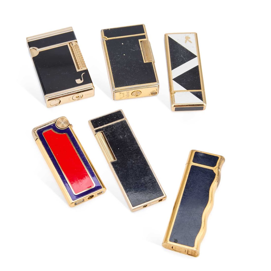 A GROUP OF LIGHTERS: including a Van Cleef & Arpels 'La Collection' example, gold plated with black enamel panels, serial no. 2206072; etc. (Qty) First 7.4cm high