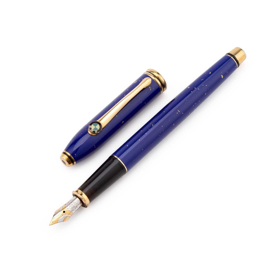 A CROSS TOWNSEND BMW FOUNTAIN PEN: lapis lazuli blue lacquer with gold flecks, gold plated mounts, the BMW logo applied to the clip, with a bi-colour Cross nib stamped '18K 750'. 15cm long