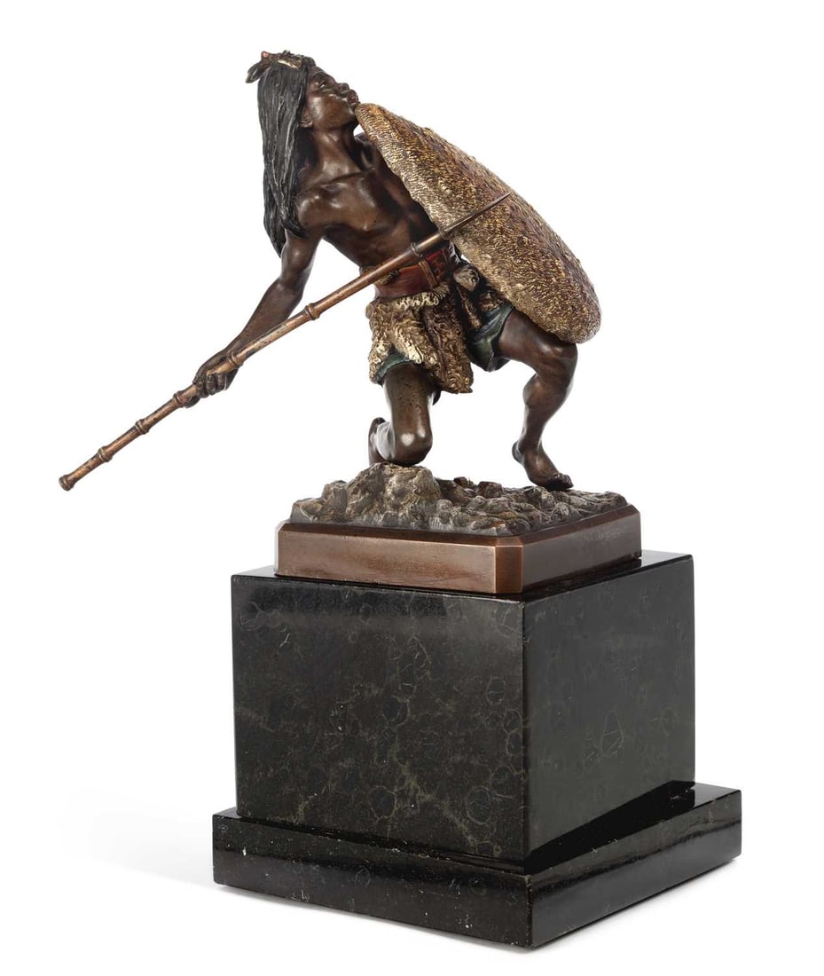 FRANZ BERGMAN (AUSTRIAN 1861 -1936), A COLD PAINTED BRONZE OF A WARRIOR CIRCA 1910: modelled as a crouching warrior behind a shield and brandishing a spear, set upon a squared marble base, stamped foundry mark, model number 3678 and Geschutzt. 27.5cm high
