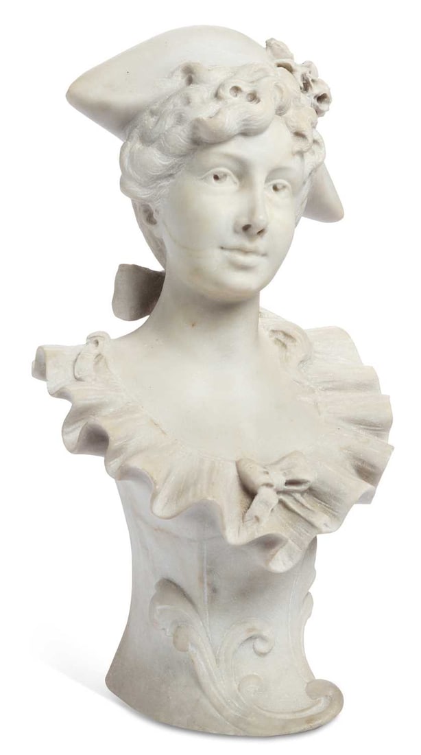 A CARVED ALABASTER BUST OF A YOUNG WOMAN: modelled wearing a tricorn hat trimmed with a rosette, her hair dressed in curls above a ruffled collar tied with a bow, the reverse incised with an indistinct signature beginning Prof., on a scrolled