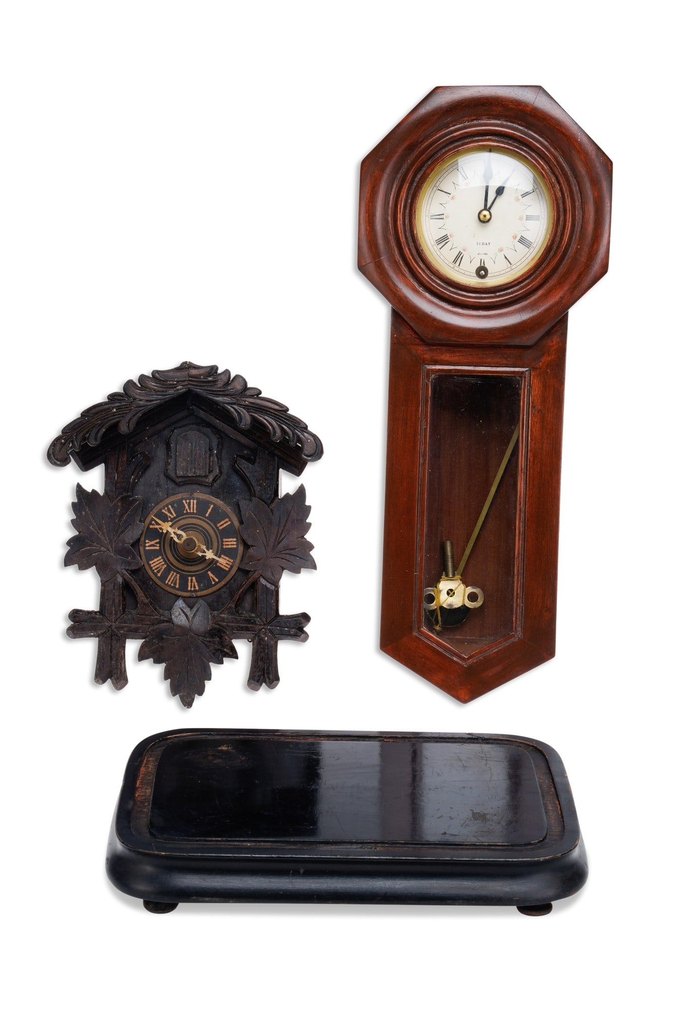 AN ALABASTER MANTEL CLOCK AND THREE OTHER CLOCKS: comprising the first with four gilt metal reeded columns supporting a stepped top surmounted by a gilt spelter lion, the case applied with rosette bosses set with red hardstone, the white enamel chapt
