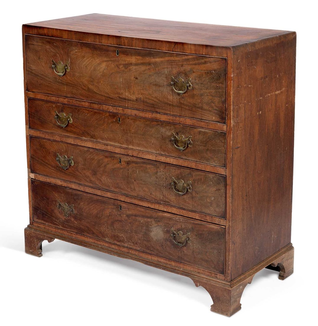A GEORGE III MAHOGANY SECRETAIRE CHEST: the crossbanded top above a fall front secretaire drawer on brass quadrant stays, enclosing a paper lined interior, above three long graduated drawers, with brass plate handles, on bracket feet. 104.5