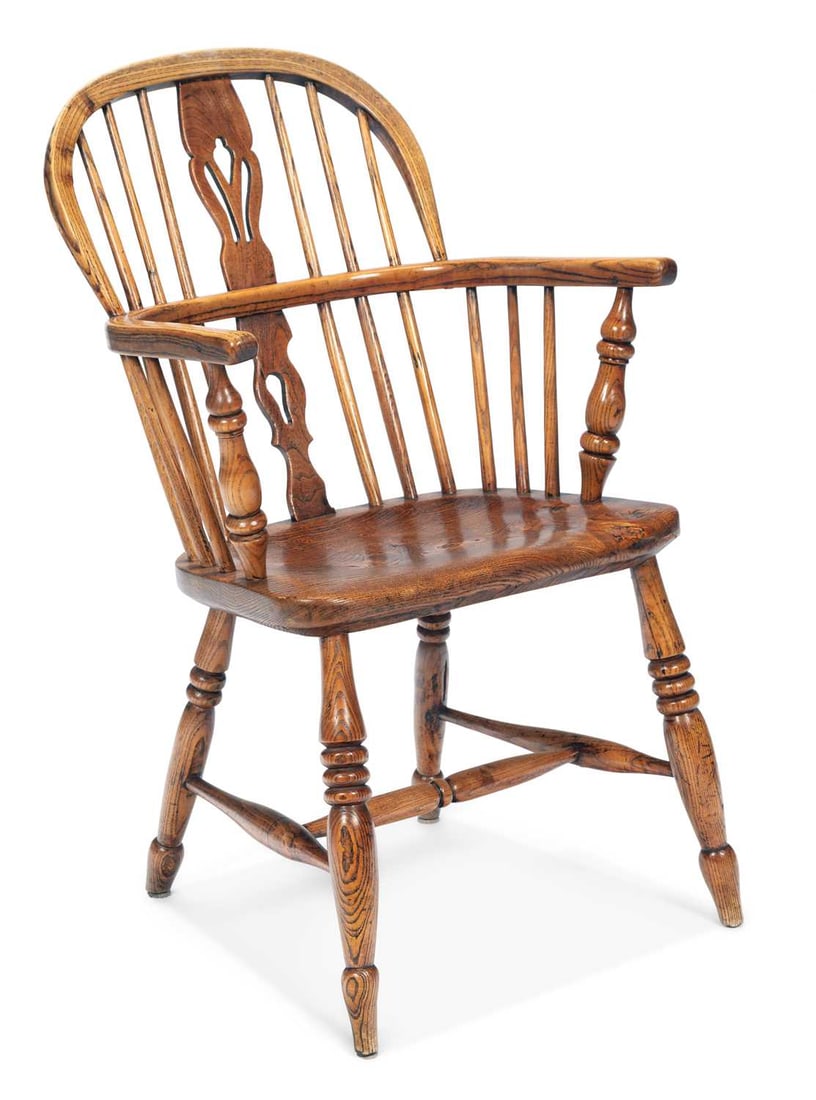 A 19TH CENTURY ELM AND OAK WINDSOR CHAIR: with a well figured seat, raised on splayed ring turned legs, joined by an H-form stretcher. Height of back 90cm