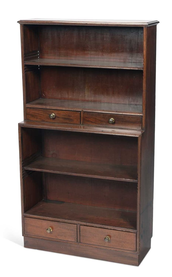 A MAHOGANY WATERFALL BOOKCASE 19TH CENTURY: in two graduated sections, each with adjustable shelves above a pair of short drawers with brass knob handles, on a plinth base. 129.5cm high, 73.5cm wide, 25.5cm deep