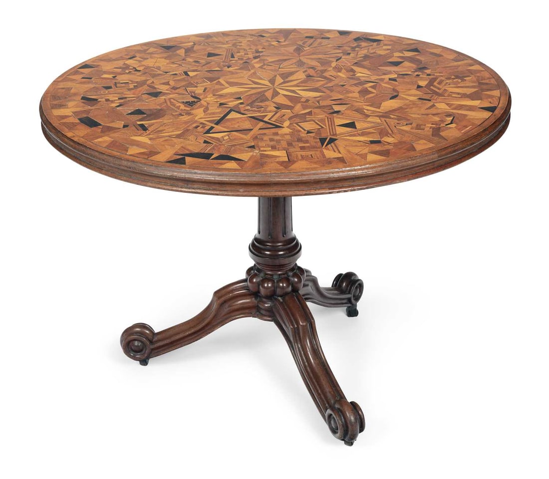 A SPECIMEN WOOD PARQUETRY TILT TOP TABLE 19TH CENTURY: the circular tilting top inlaid throughout in specimen woods with a central eight point star within a field of stars, rosettes, cubes, chequers and geometric panels, interspersed with stylised birds