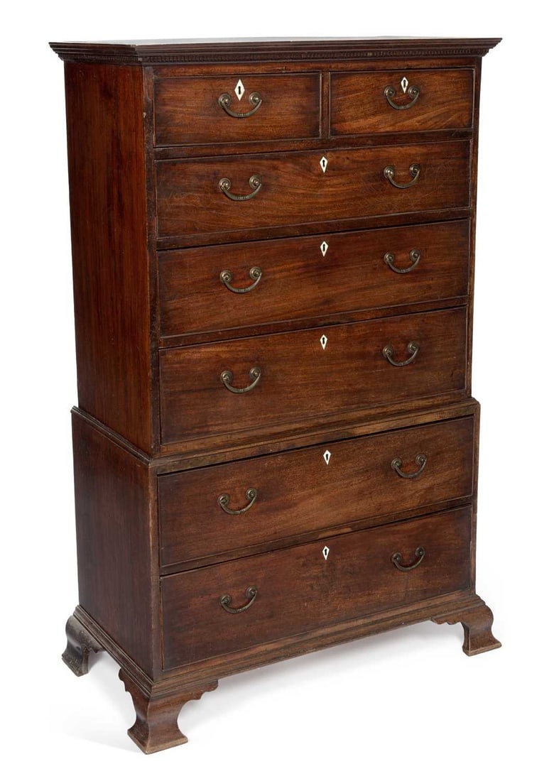 CITES - A GEORGE III MAHOGANY CHEST ON CHEST: with a dentil moulded cornice, the upper section fitted with two short and three long graduated drawers, the base with two long drawers, with brass swan neck handles and ivory lozenge escutcheons thro