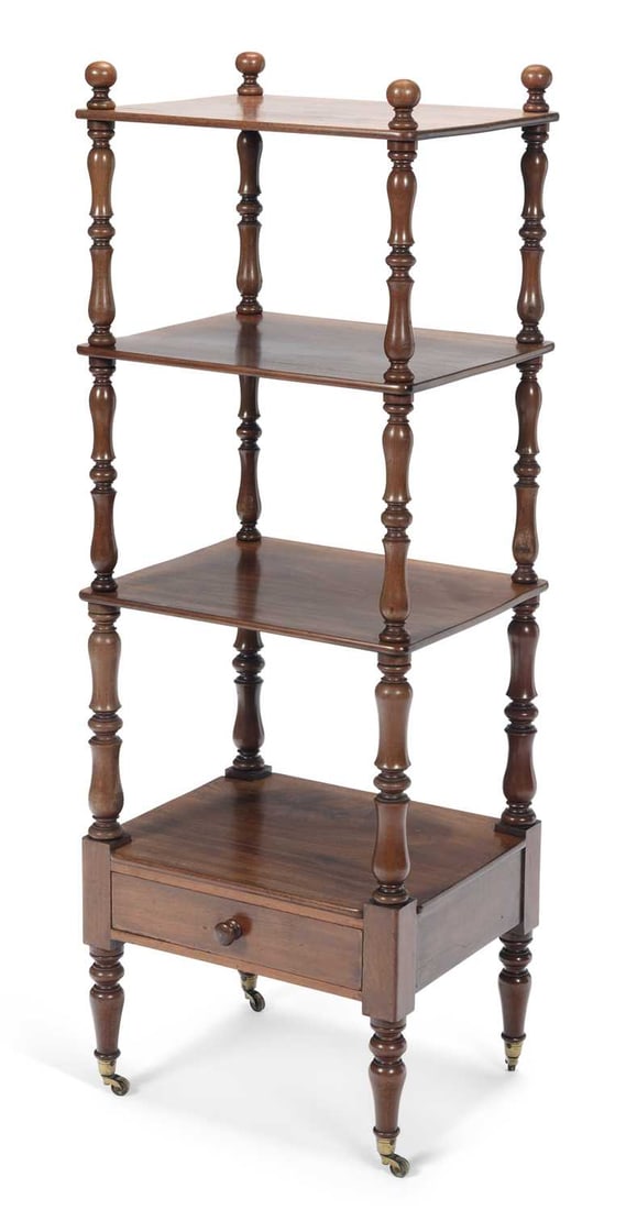 A WILLIAM IV MAHOGANY WHATNOT: of four tiers, the rectangular platforms divided by baluster turned uprights with ball finials, the base tier with a single frieze drawer with turned knob handle, on turned legs and brass castors.
