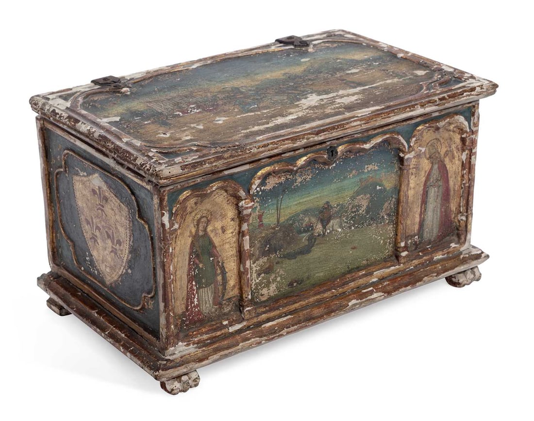 A PAINTED AND PARCEL GILT CASKET IN THE ITALIAN RENAISSANCE TASTE 19TH CENTURY: of rectangular form with a hinged cover, painted in polychrome and gilt on a gesso ground, the cover with a landscape of a mounted figure before a colonnade, the front with two saints beneath arches f
