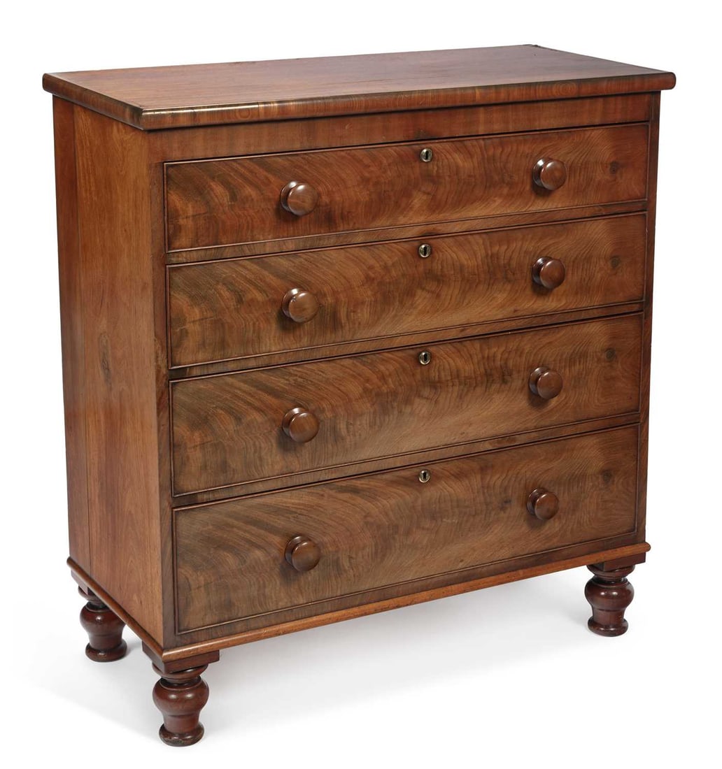 A VICTORIAN MAHOGANY CHEST OF DRAWERS: the moulded rectangular top above four long graduated drawers, each with flame mahogany veneered front with a cockbeaded border, with turned mahogany knob handles and brass escutcheons, on turned bun 