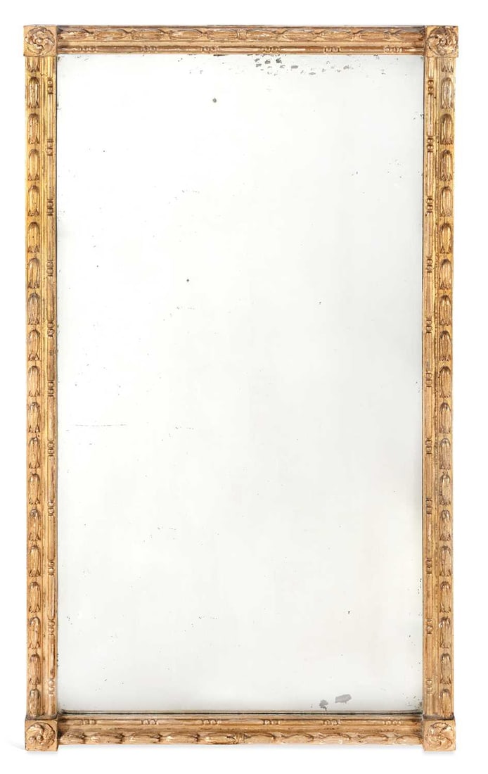 A REGENCY GILTWOOD AND GESSO WALL MIRROR: the rectangular bevelled plate within a moulded frame decorated with bound laurel, the corner blocks applied with rosette paterae. 102cm by 57.5cm