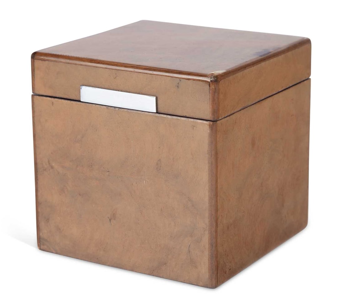 A DUNHILL BURR WOOD CIGAR HUMIDOR: of square form, the case veneered in burr wood, the hinged cover with a metal thumbpiece, opening to a white lined interior, the underside with a Dunhill Paris label. 13cm high, 13.5cm wide