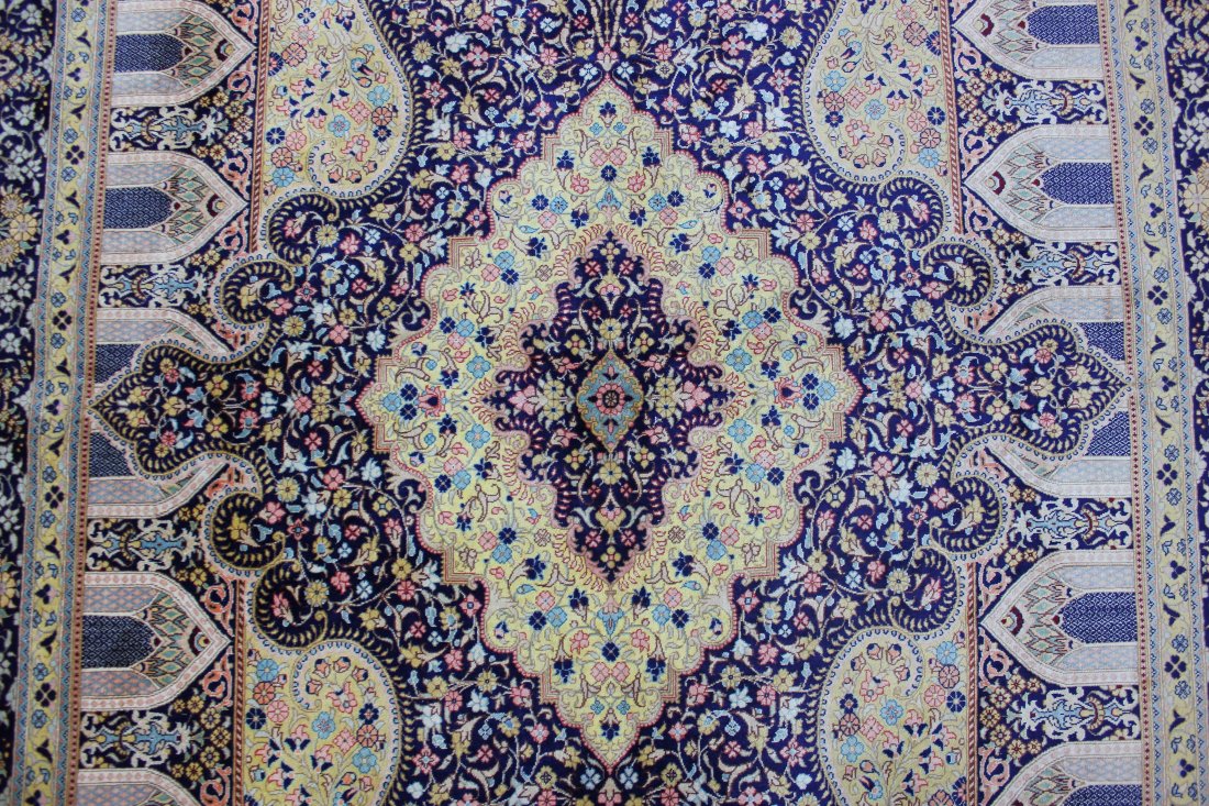 QUM SILK PRAYER RUG BY M. JAMSHIDI 4'1" X 6'5", 124X196: Region: Qom, Persia. Workshop: Master Mohammad Jamshidi. Date: late 20th century. Knot Density (sq inches): 756. Weave: hand-knotted. Warp (foundation): pure silk. Pile: pure silk. Colours: Blue and y