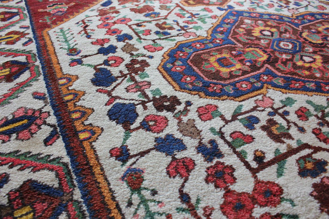 ANTIQUE PERSIAN BAKHTIARI, 5'6" X 10'0", 168 X 305 CM: Region: Bakhtiari, Persia. Date: Mid 20th century. Warp: cotton. Pile: wool. This Bakhtiari rug has deep lustrous lanolin-rich wool characteristics and vibrant colours procured through in-depth knowle