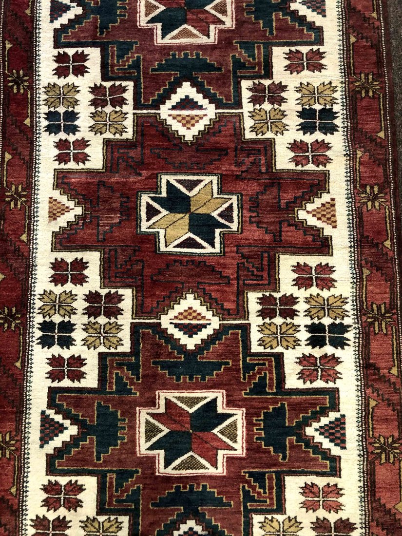 VINTAGE WOOLLEN TRIBAL RUG, 3'4" X 6'0", 101 X 183 CM: Region: Central Asia. Design: Geometric. Knot Density (sq inch): 140. Weave: hand-knotted. Warp (foundation): Wool. Pile: Wool.------ Keshmiri Auction is the curator and purveyors of the finest, authe