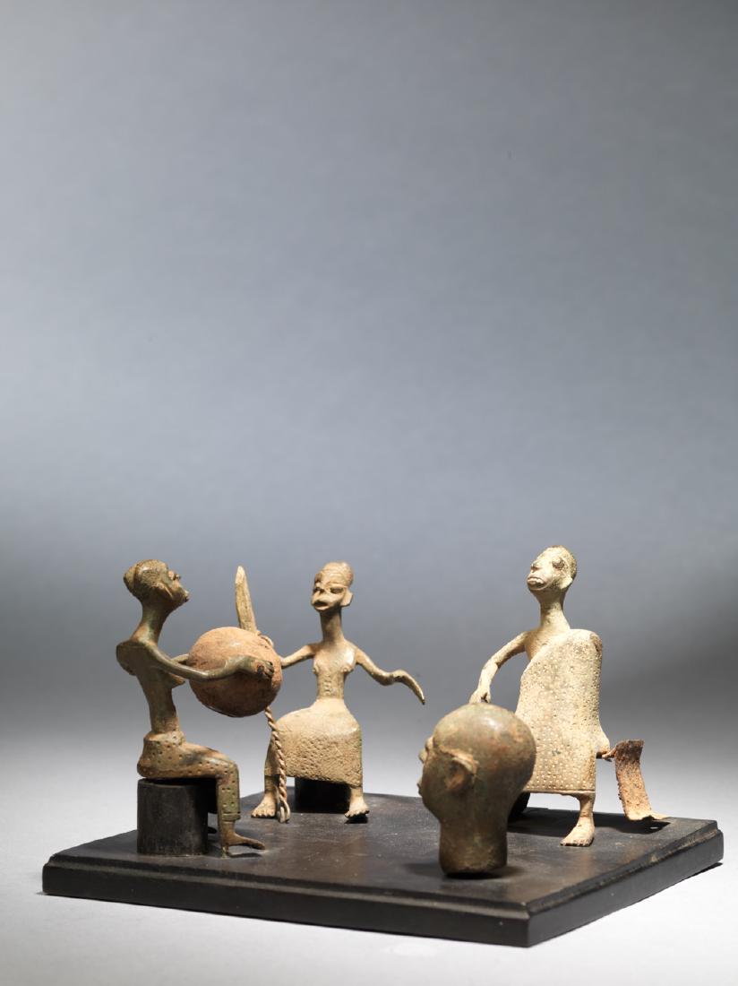 Four Fon altar figures: Four bronze and iron ornamental figures that were used on Fon altars. All the figures are intricately detailed, in nice condition and are mounted to a single base. A beautiful, intimate piece. Dimensi