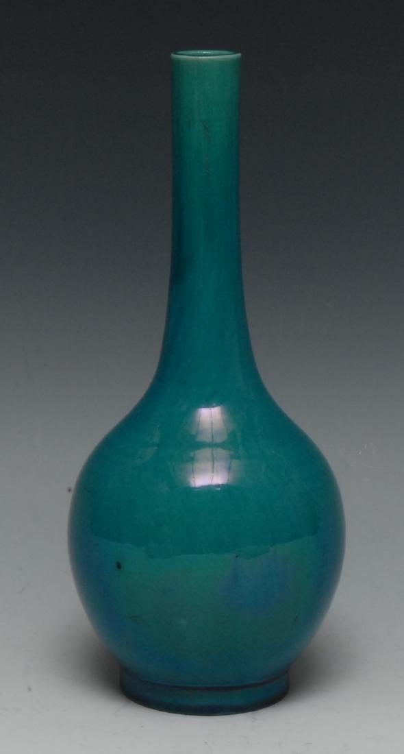 A Japanese Awaji monochrome slender ovoid bottle vase,: A Japanese Awaji monochrome slender ovoid bottle vase, glazed in tones of mottled turquoise, 25cm high, impressed marks, Meiji period
