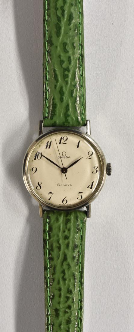 Omega - a retro 1960's Geneve wristwatch, cream dial,: Omega - a retro 1960's Geneve wristwatch, cream dial, Arabic numerals, centre seconds, blued hands, manual 601 cal movement, serial No 25074500, stainless steel case, No 131.018, green leather strap,