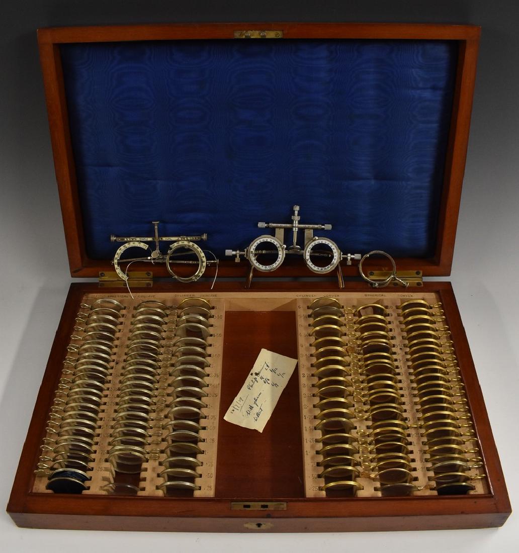 Medical Interest - Optometry - an early 20th century: Medical Interest - Optometry - an early 20th century optician's trial lens set, the mahogany case with brass escutcheons, 44.5cm wide