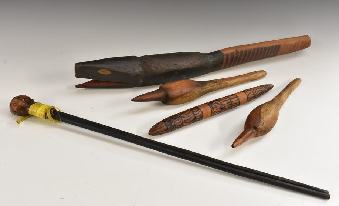 An Australian Aboriginal carving, of a snake, decorated: An Australian Aboriginal carving, of a snake, decorated in earth tones, 64cm long; a digging stick; etc (5)