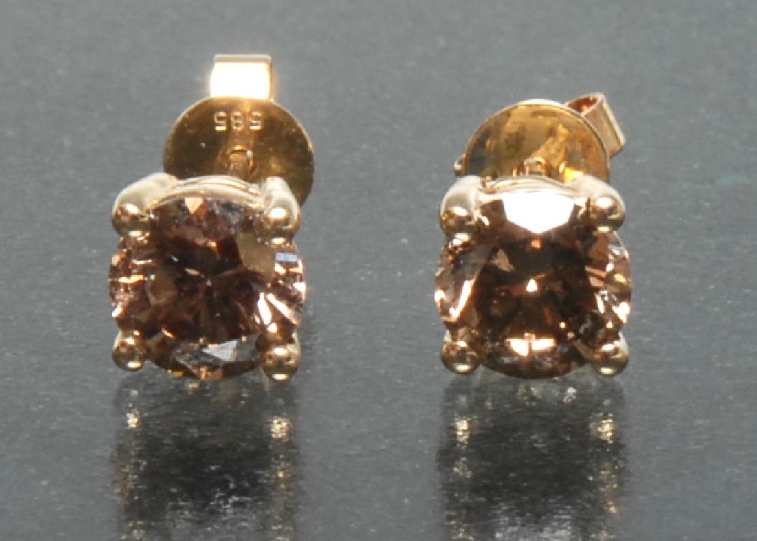 A pair of cognac diamond stud earrings, each round (1 of 1)