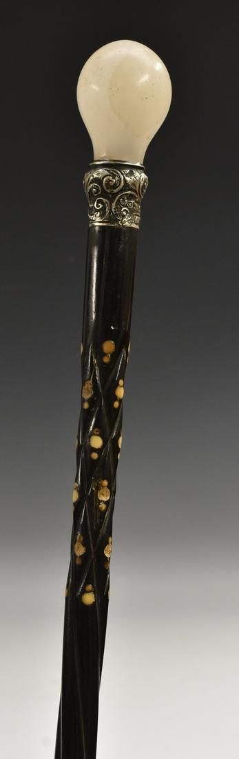 A gentleman's white onyx and silver mounted walking: A gentleman's white onyx and silver mounted walking stick, sprally fluted Anglo-Indian ebony shaft, composed, the ferule Birmingham 1892