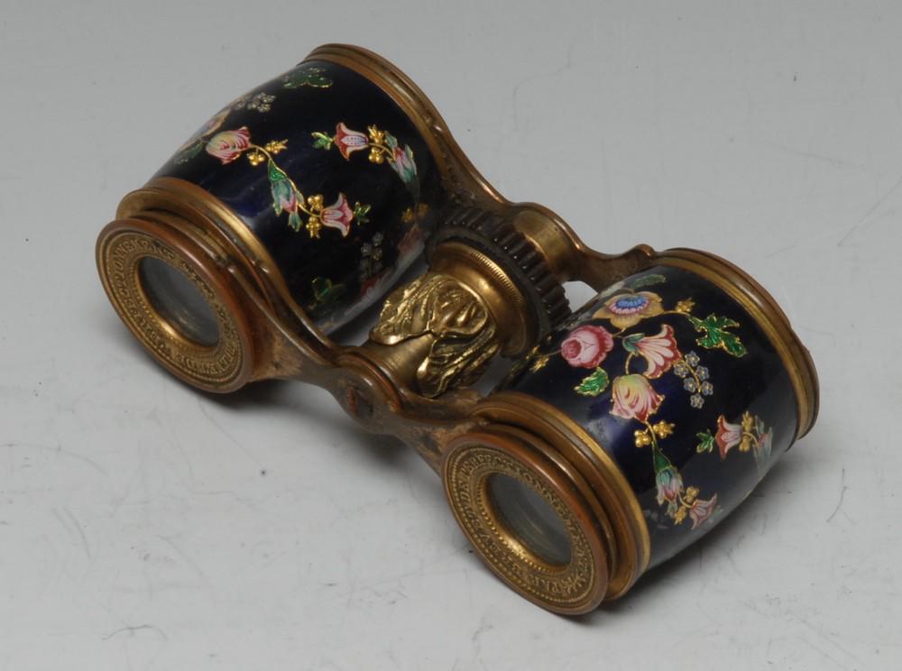 A pair of 19th century French lady's enamel gilt-brass: A pair of 19th century French lady's enamel gilt-brass and enamel opera glasses, Par Brevet de Perfectionnement, decorated in polychrome with roses, tulips and further summer flowers on a royal blue g