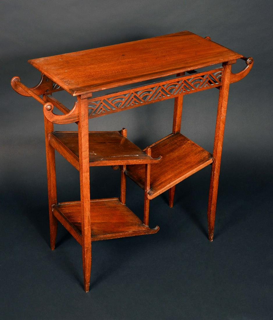 An Aesthetic movement mahogany side table, in the: An Aesthetic movement mahogany side table, in the Japanesque taste, rectangular top above a pierced trellis frieze and an asymmetric arrangement of shelves, 76cm high, 76cm wide, c.1890