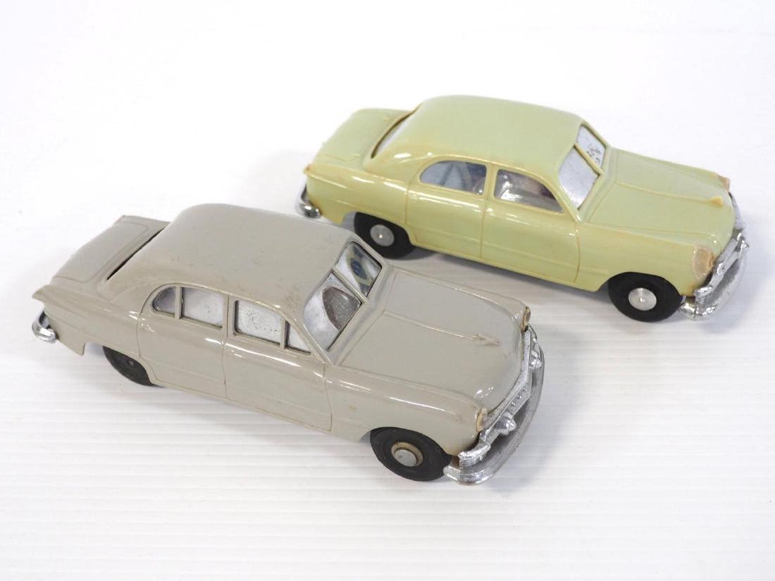 (2) 1950's Ford key-wind promo cars: (2) 1950's Ford 7"long key-wind promo cars: light green / grey - Both Good