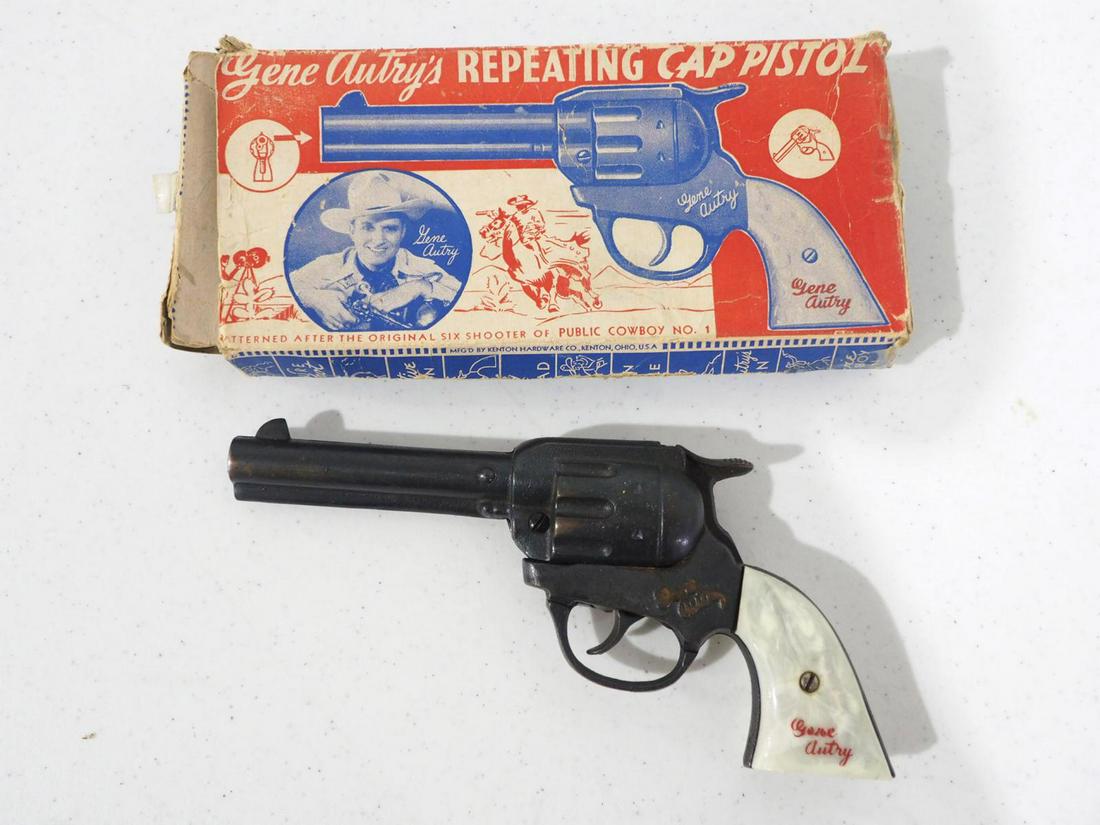 Kenton cast iron Gene Autry cap gun: Kenton cast iron Gene Autry cap gun with box -Good, gun functions well, box is rough