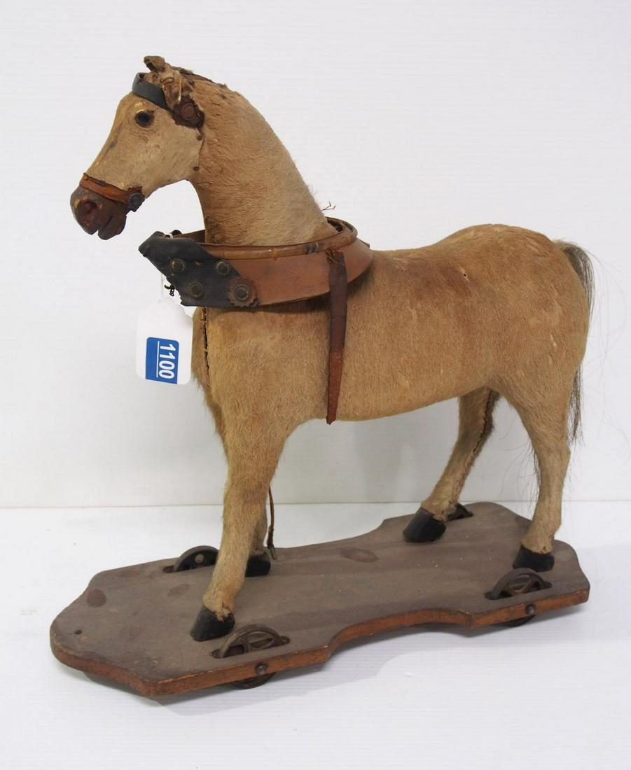 Early horse pull toy: 18"x7"x19"h early horse pull toy covered in horse hide -Good