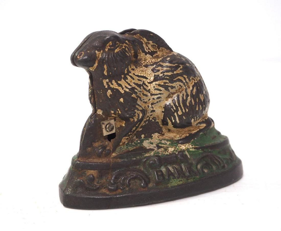 Cast iron rabbit bank, dated 1884 (1 of 3)
