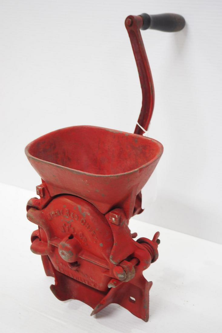 Table-mount Red Chief hand crank corn grinder: Embossed iron table-mount Red Chief hand crank corn grinder