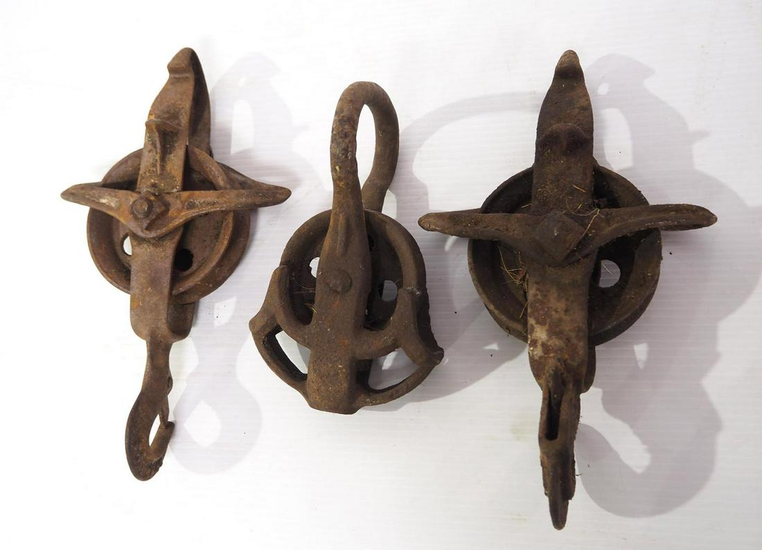 (3) Iron hay car pulleys (1 of 1)