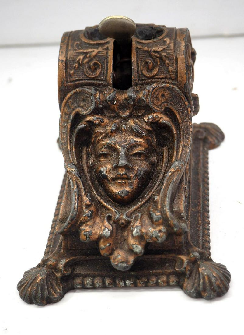 Cast iron cigar cutter: 3"x5"x3" cast iron cigar cutter with fancy face image -Good