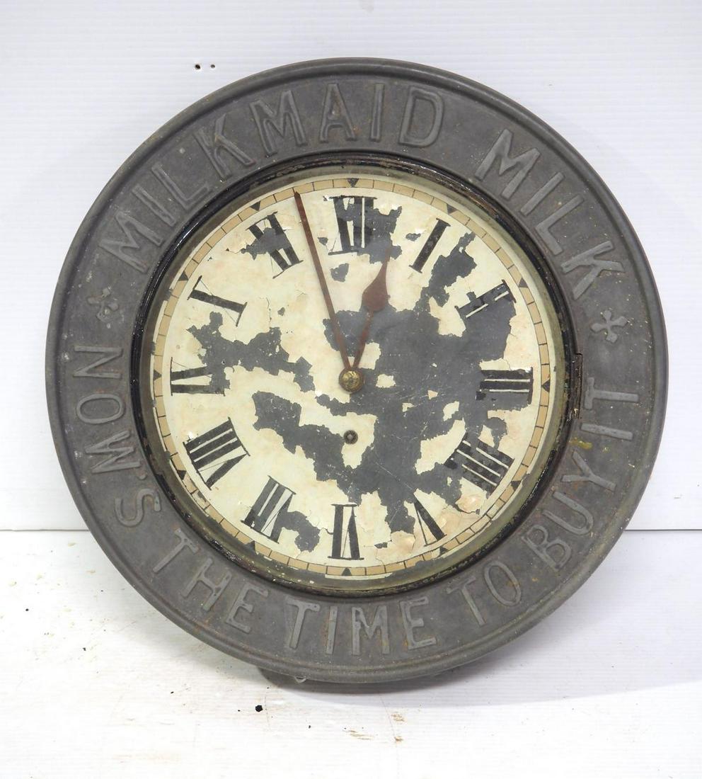 Milk Maid Milk advertising clock: 17"dia. metal, glass & wood Milk Maid Milk advertising clock -Very Rough -This lot will go to the UPS Store for packing & shipping.