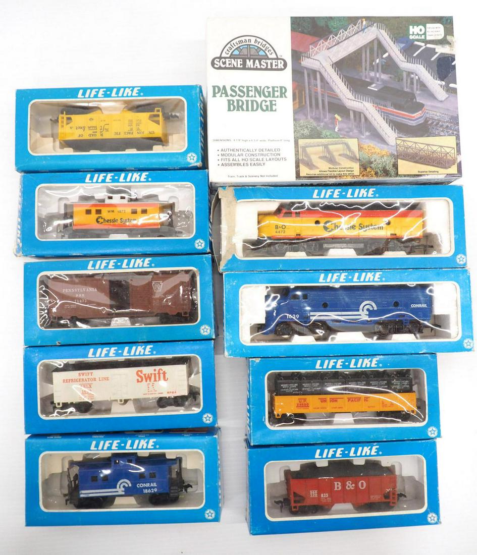 (9) HO train cars/engines & Passenger Bridge: (9) Life-like HO train cars/engines in original boxes / Scene Master HO Passenger Bridge -Excellent