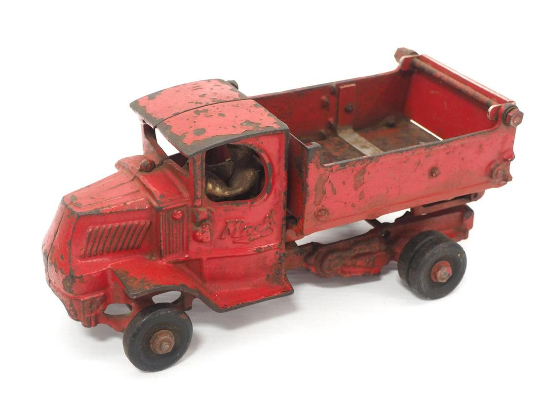 Arcade Mack Dump Truck: Arcade Mack Dump Truck, cast iron with rubber tires & driver -Good original, paint is worn