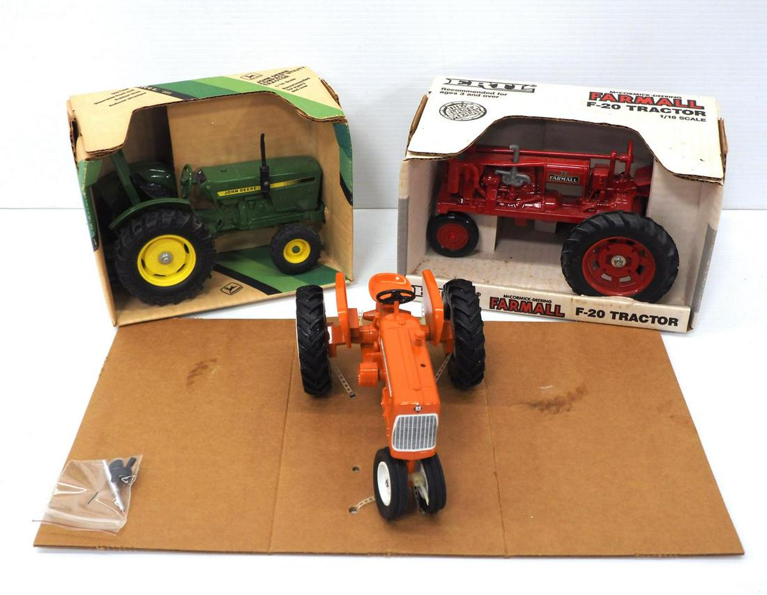 (3) 1/16 scale tractors, all NIB (1 of 2)