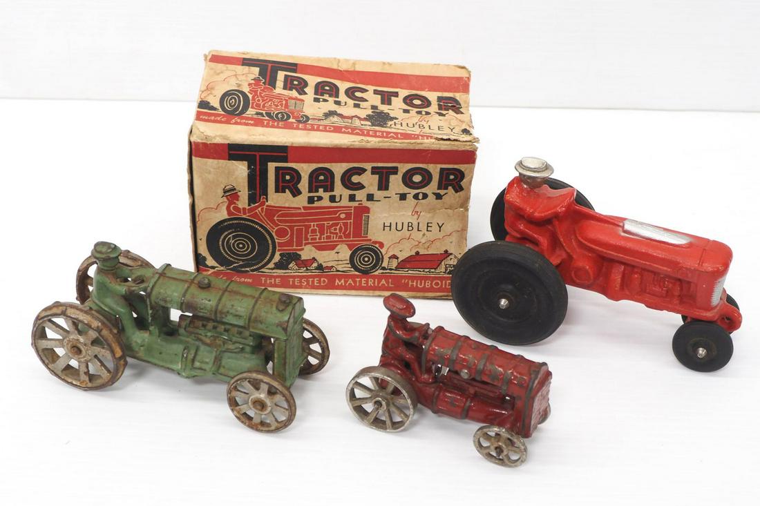 (3) Small tractors: (3) Small tractors: Hubley rubber with rough box, 5½"L / (2) Arcade cast iron 3½"L & 4½"L