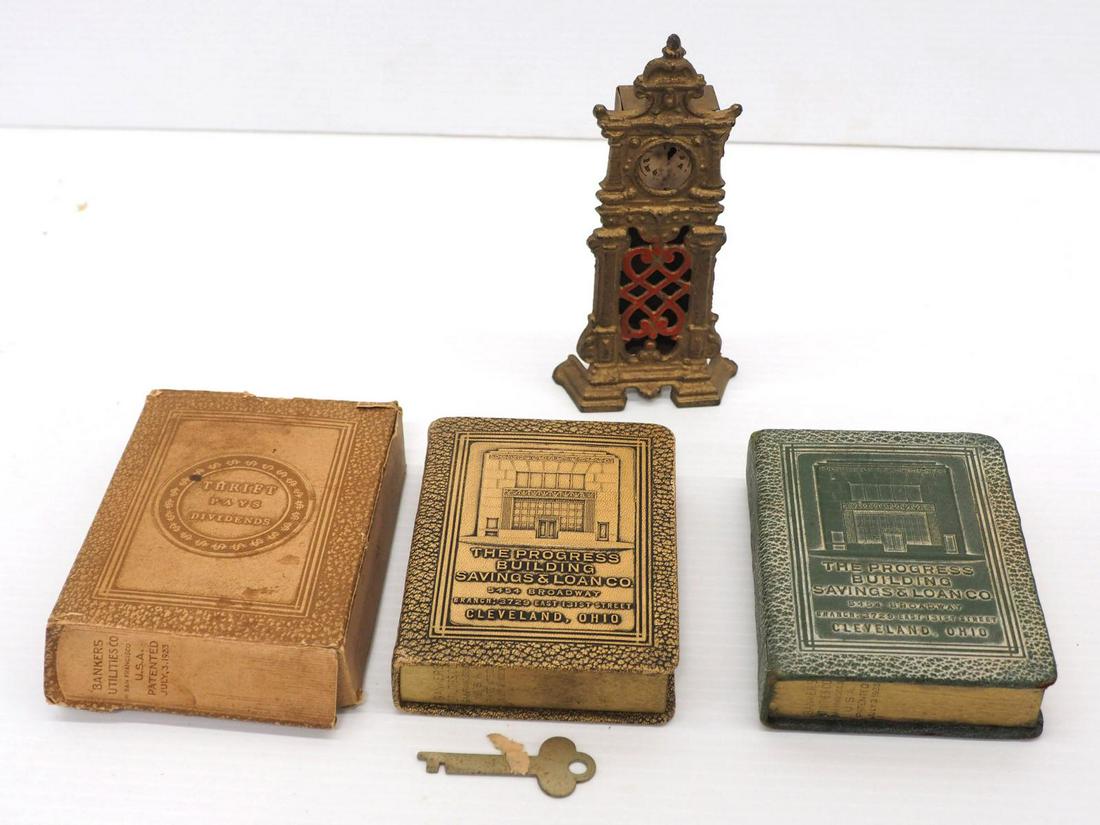 (3) Cast iron banks: (3) Cast iron banks: Grandfather Clock / (2) Cleveland Book banks, one with key & original cardboard box -Good