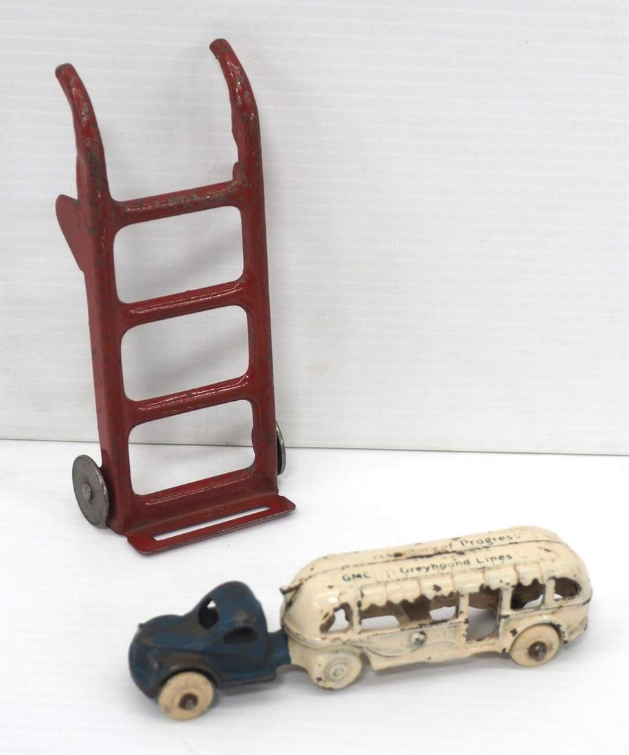 (2) Cast iron toys: (2) Cast iron toys: Century of Progress Greyhound Bus, 5½"L / Buddy L Dolly, 6"L -Good