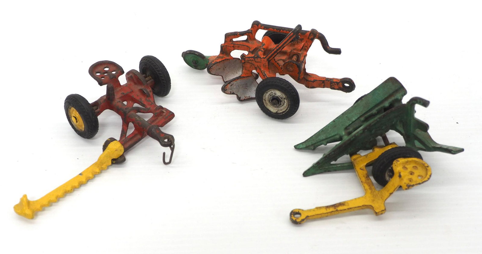 (3) Arcade cast iron farm implements: (3) Arcade cast iron Farm Implements: Sickle Mower, Plow & Corn Harvester -Good original