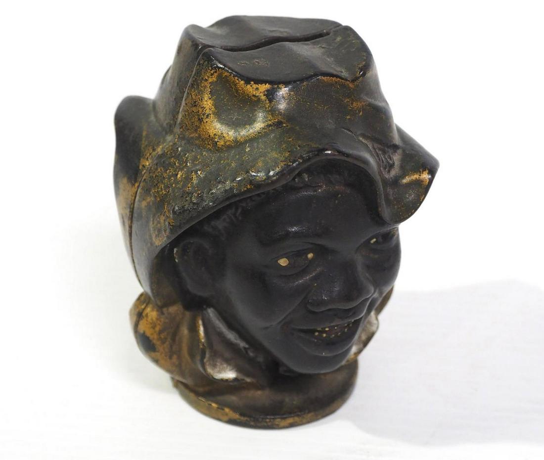 Cast iron 2-faced black boy bank (1 of 3)