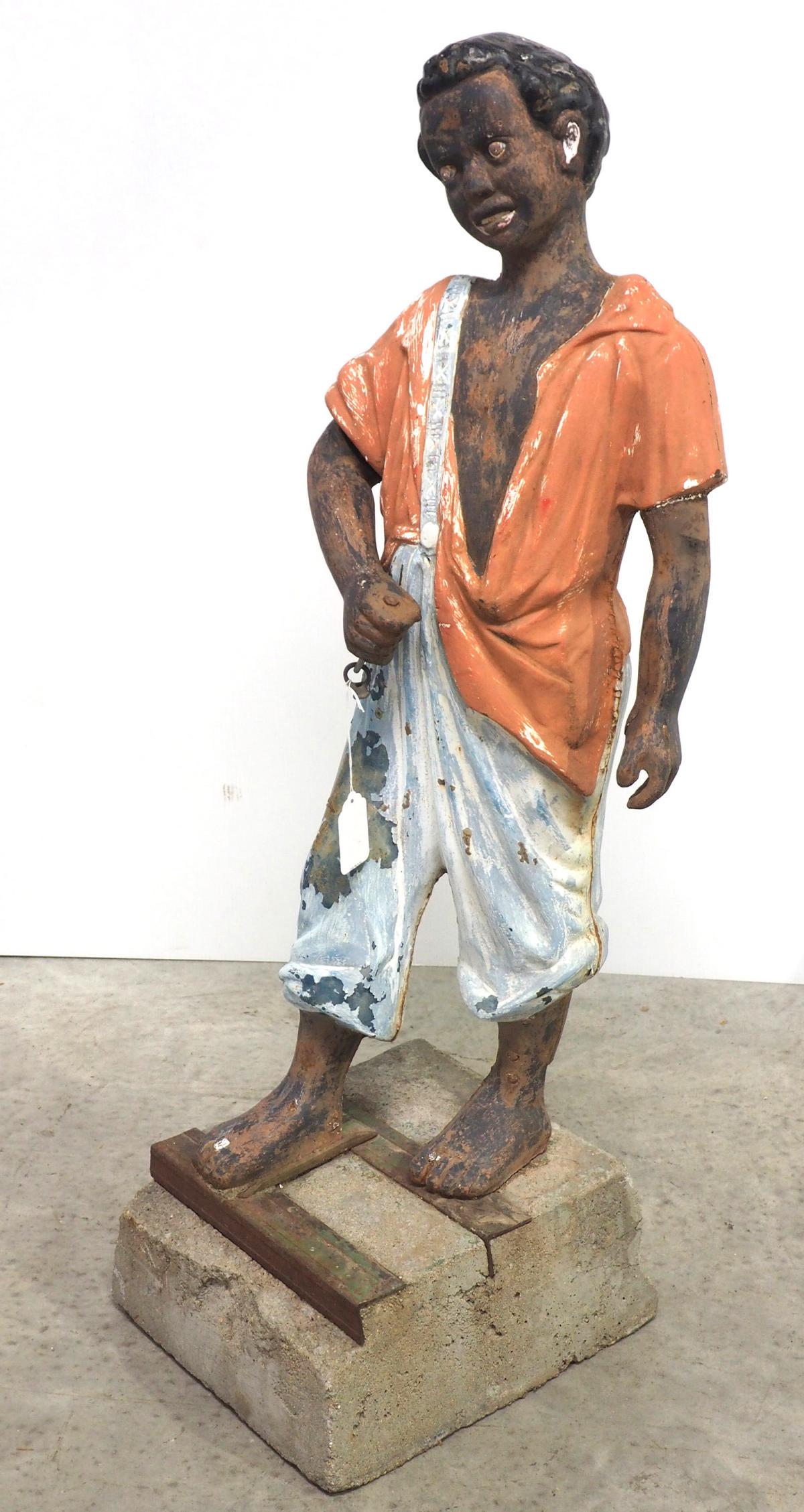 Cast iron hitching post of black boy on bale of cotton (1 of 6)