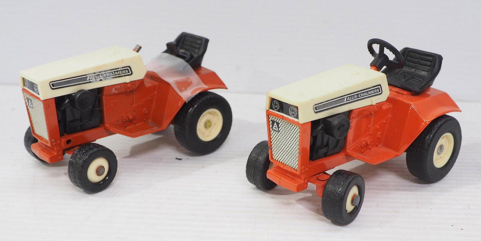 (2) Ertl Allis Chalmer Lawn & Garden Tractors: (2) 1/16 scale Ertl Allis Chalmer Lawn & Garden Tractors - Good, one has steering wheel broken off